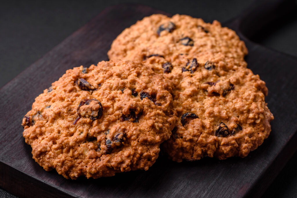 delicious-baked-oatmeal-raisin-cookies-on-a-dark-counter