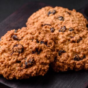 delicious-baked-oatmeal-raisin-cookies-on-a-dark-counter